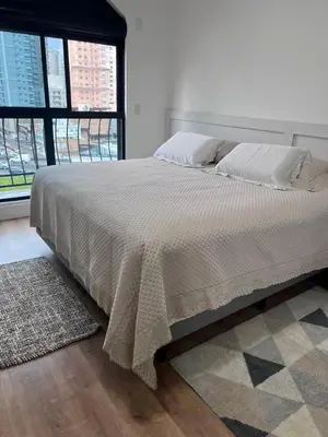 Uma cama ou camas num quarto em Apartamento, quadra mar