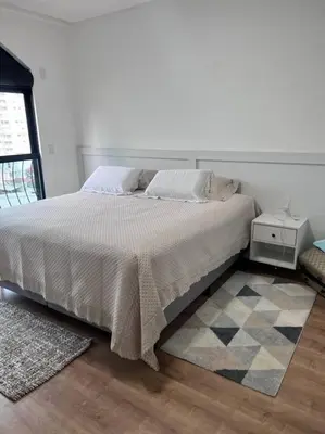 Uma cama ou camas num quarto em Apartamento, quadra mar