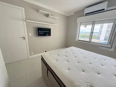 Uma cama ou camas num quarto em Ótimo Quadra Mar na Barra Sul em BC