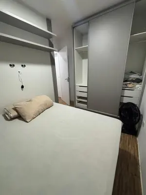 Uma cama ou camas num quarto em Apartamento Vagner