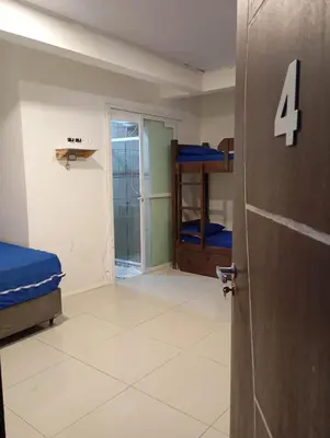 Uma cama ou camas num quarto em Pousada Morro dó Macaco ARTE