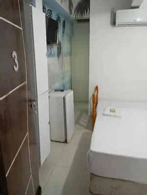 Uma cama ou camas num quarto em Pousada Morro dó Macaco ARTE