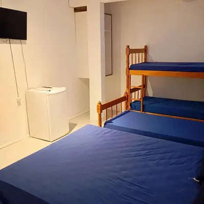 Uma cama ou camas num quarto em Pousada Morro dó Macaco ARTE