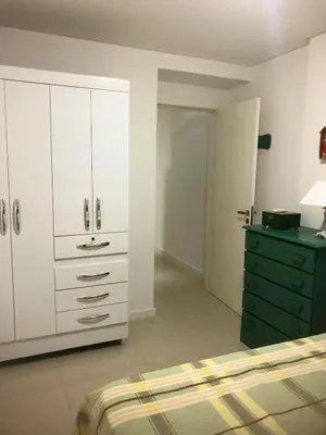 Uma cama ou camas num quarto em Apartamento Meia Praia