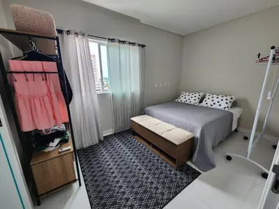 Uma cama ou camas num quarto em Residencial Imperador Vista Mar