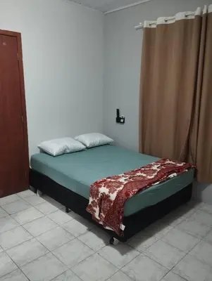 Uma cama ou camas num quarto em Casa 500 metros praia do centro