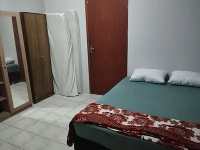 Uma cama ou camas num quarto em Casa 500 metros praia do centro