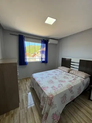 Uma cama ou camas num quarto em Hospedaria marli