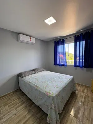 Uma cama ou camas num quarto em Hospedaria marli