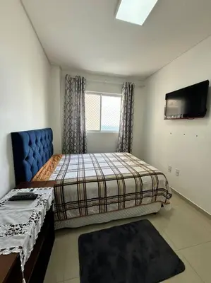Uma cama ou camas num quarto em Residencial Mirante do Mar
