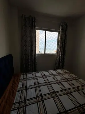 Uma cama ou camas num quarto em Residencial Mirante do Mar