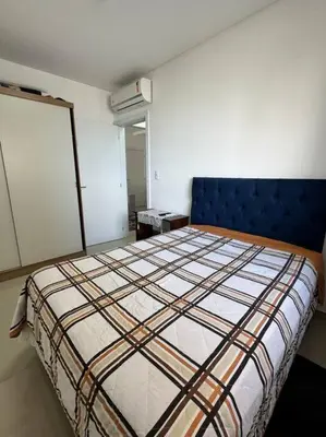 Uma cama ou camas num quarto em Residencial Mirante do Mar