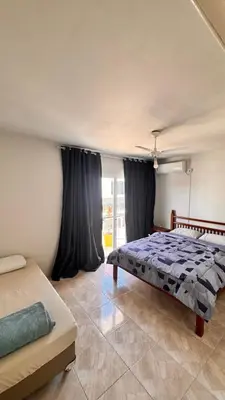 Uma cama ou camas num quarto em Casa Praia Palmas