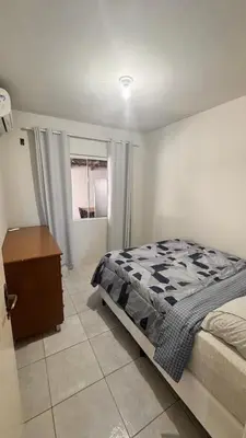 Uma cama ou camas num quarto em Casa Praia Palmas