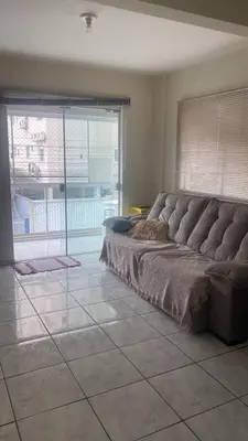 Uma área de estar em Apartamento Temporada Porto Belo