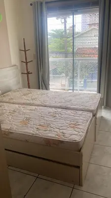 Uma cama ou camas num quarto em Apartamento Temporada Porto Belo