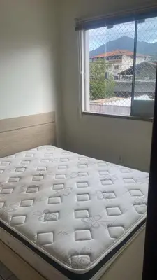 Uma cama ou camas num quarto em Apartamento Temporada Porto Belo