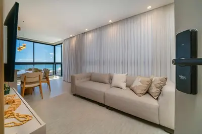 Uma televisão e/ou sistema de entretenimento em East Wind 202 - Vista Mar em Mariscal