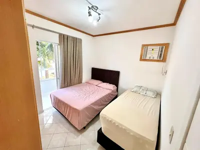 Uma cama ou camas num quarto em Apartamento em Condomínio Bromélias - Bombinhas SC
