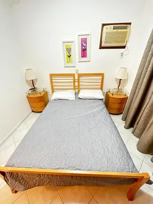 Uma cama ou camas num quarto em Apartamento em Condomínio Bromélias - Bombinhas SC