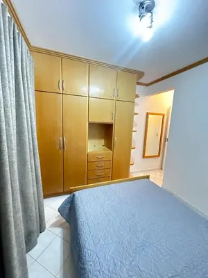 Uma cama ou camas num quarto em Apartamento em Condomínio Bromélias - Bombinhas SC