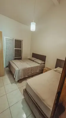 Uma cama ou camas num quarto em Sobrado a 100 metros do mar
