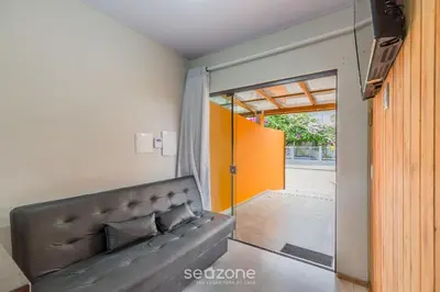 Uma área de estar em RUC - Casas a 270m da Praia do Canto Grande