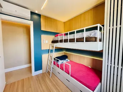 Uma cama ou camas num quarto em Cobertura na Praia de Palmas, a apenas 300 metros do mar.