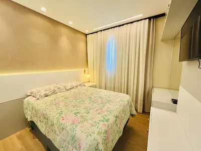 Uma cama ou camas num quarto em Cobertura na Praia de Palmas, a apenas 300 metros do mar.
