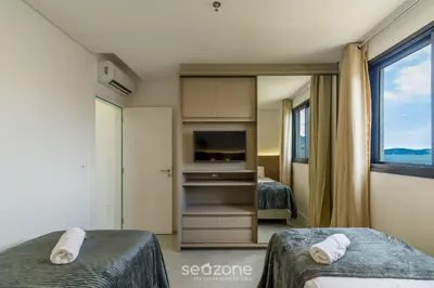 Uma cama ou camas num quarto em MHF III - Apts Variados a 280m da Praia em Itapema