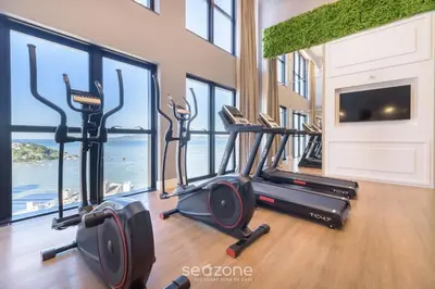 O centro de fitness e/ou as comodidades de fitness de MHF III - Apts Variados a 280m da Praia em Itapema