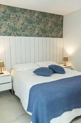 Uma cama ou camas num quarto em Ed Sky Tower 602