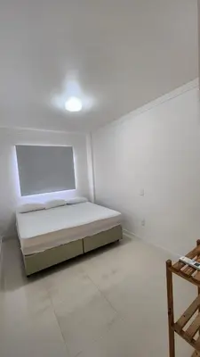 Uma cama ou camas num quarto em Lindo de Palmas