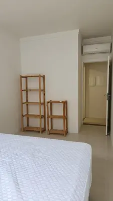 Uma cama ou camas num quarto em Lindo de Palmas