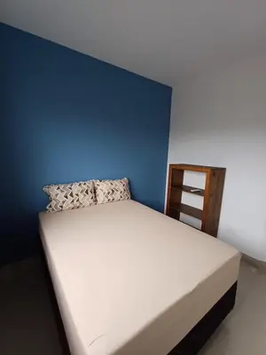 Uma cama ou camas num quarto em Ap 05 Praia de Mariscal