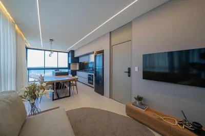 Uma televisão e/ou sistema de entretenimento em East Wind 201 - Vista Mar em Mariscal