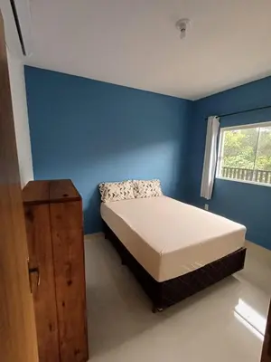 Uma cama ou camas num quarto em AP 02 Praia de Mariscal