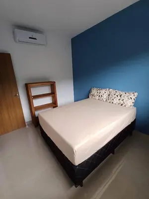 Uma cama ou camas num quarto em AP 02 Praia de Mariscal