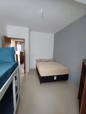 Uma cama ou camas num quarto em AP 04 Praia Mariscal 800mt mar