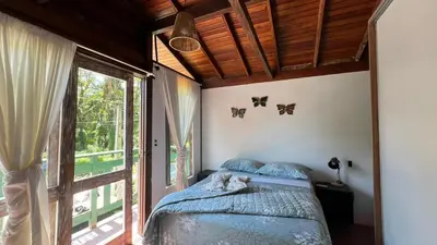 Uma cama ou camas num quarto em Casa Saíra