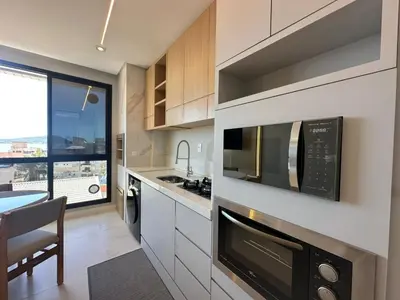 A cozinha ou kitchenette de Mirante do Oceano hospedaria à 70 metros da praia, com piscina aquecida, sala de jogos, academia e espaço kids!!