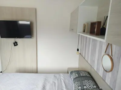 Uma cama ou camas num quarto em AP 2 Quartos