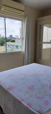 Uma cama ou camas num quarto em Apartamento 202 Bombinhas
