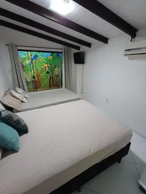 Uma cama ou camas num quarto em Casa Estação Atlântica