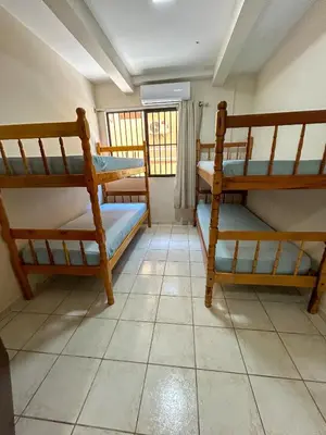 Uma cama ou camas num quarto em Tucano 01 a passos do mar com área gourmet