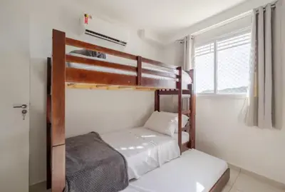Uma cama ou camas num quarto em RiNay Sol e Mar Itapema