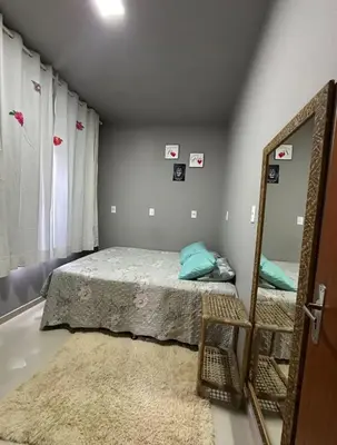 Uma cama ou camas num quarto em Casa para família em Bombinhas