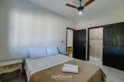 Uma cama ou camas num quarto em Casa 3Q c/ Churrasqueira 140m da Praia RAE0126