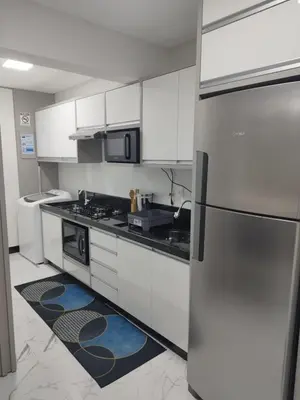 A cozinha ou kitchenette de Apartamento temporada - Meia Praia
