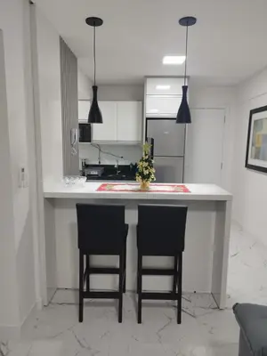 A cozinha ou kitchenette de Apartamento temporada - Meia Praia